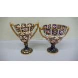 Two Royal Crown Derby porcelain Imari pattern two handled goblets - 1909 & 1911 - Ht. 5 ins