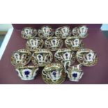 A set of twelve Royal Crown Derby Imari pattern tea cups, saucers, milk jug and sugar basin -