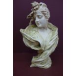Art Nouveau porcelain head and shoulders of a girl with a bun and green scarf signed E. Stellura ? -