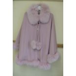 Ladies pink cashmere poncho with pink fox fur collar, trim and pom poms size 12