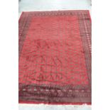Large mainly red wool Bokhara carpet 150 X 112ins
