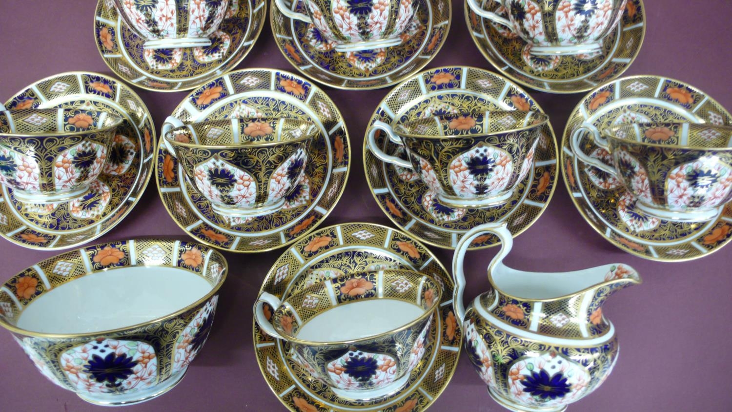 A set of twelve Royal Crown Derby Imari pattern tea cups, saucers, milk jug and sugar basin - - Image 3 of 5
