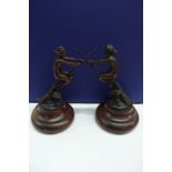 Greco?, Nude girls flying on broom sticks above owls, bronze on wooden stepped pedestals height 7.