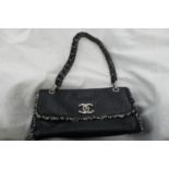 Chanel black leather tweedy flap bag - having plaited material and chrome link handle, chrome