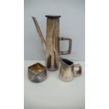 Designer three piece silver four sided coffee service with a brick wall decoration - Maker John