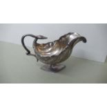 Late Victorian silver scallop shell sauce boat with sea snake handle on a diamond shaped base -