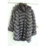 Ladies reversible shower proof brown fox fur coat in a chevron pattern size 12/14 with hood
