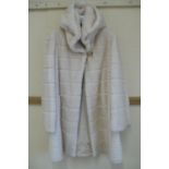 Ladies blond mink mid length coat with hood having a layered design size 12, platinum quality by