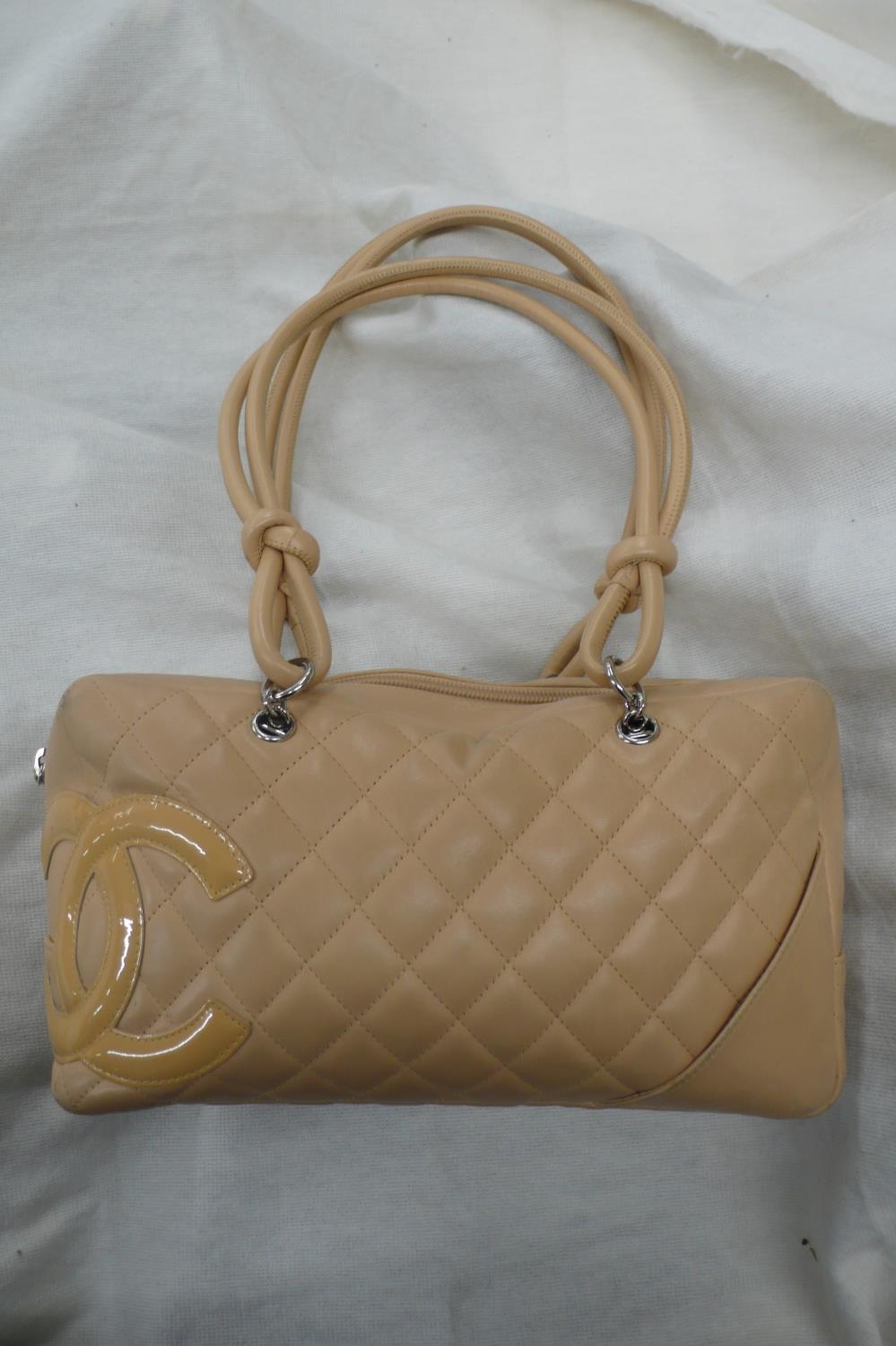 Chanel quilted peach leather handbag with patent leather logo, knot and loop handles, chrome
