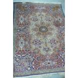 Middle Eastern multi coloured hand made wool carpet with floral designs 85 x 60ins