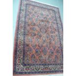 Middle Eastern deep pink and floral carpet with eight borders and multi coloured wools - 85 X 53 ins