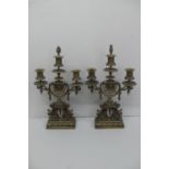 Pair of late Victorian ornate brass three branch candelabra with flaming torch finial, decoration of