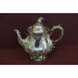 A quality Victorian EPNS tea pot with bird finial and lobed body