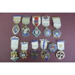 Eleven silver gilt enamel jewels by Spencer London and others for The Royal Masonic Institution