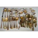 A quantity of silver flatware, including dinner forks, table spoons, teaspoons and serving spoons,