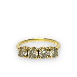A 14ct yellow gold dress ring, set with four faceted stones, ring weighs 2.3 grams, together with