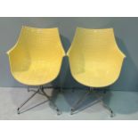 A pair of retro ‘Driade Meridiana’ style cream plastic chairs, with incised square decoration and