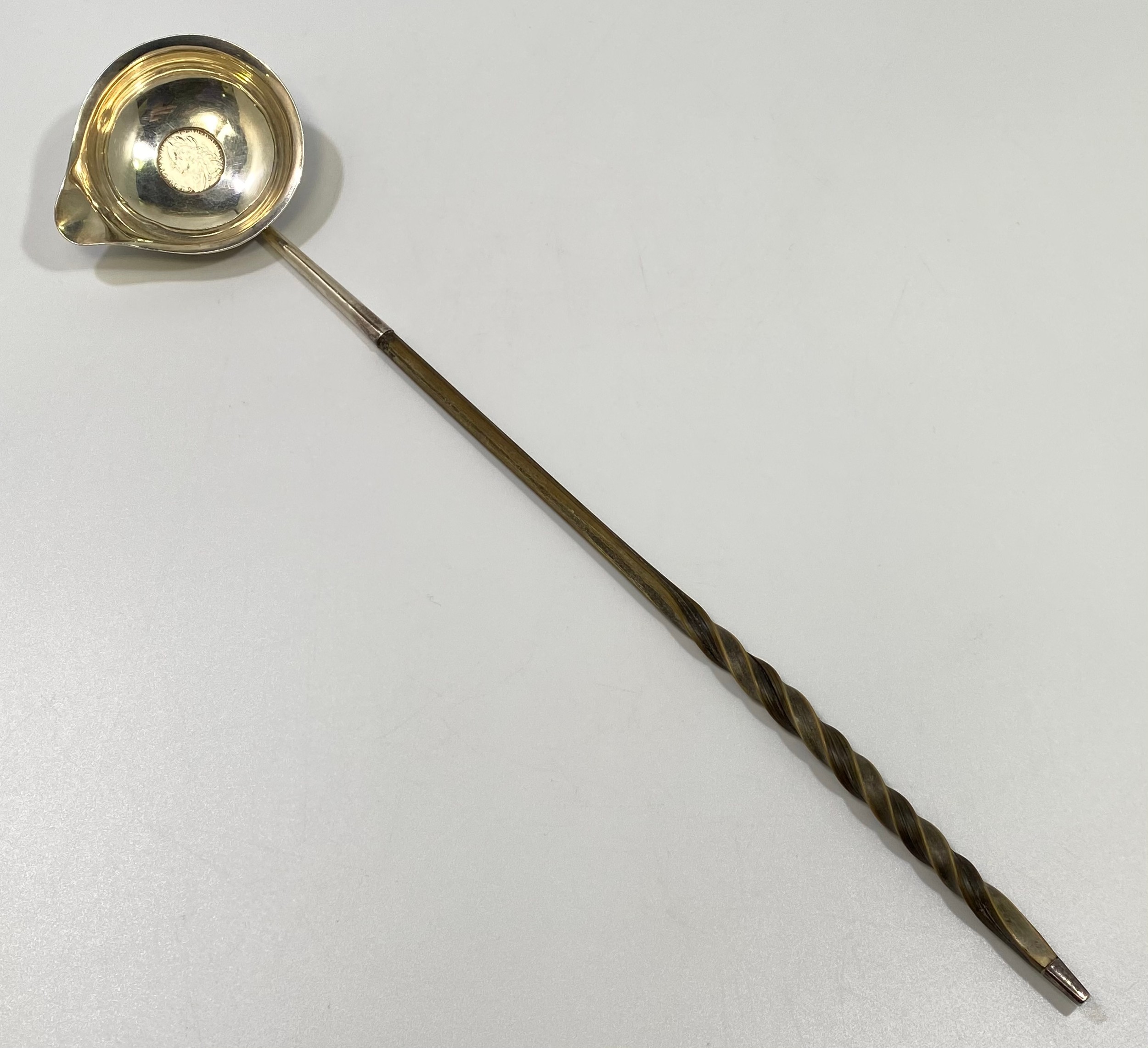 A George II silver toddy spoon, the bowl inset with a silver shilling and turned horn handle, - Image 4 of 4