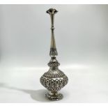 A late 19th / early 20th century Indian silver rosewater sprinkler, with continuous embossed foliate