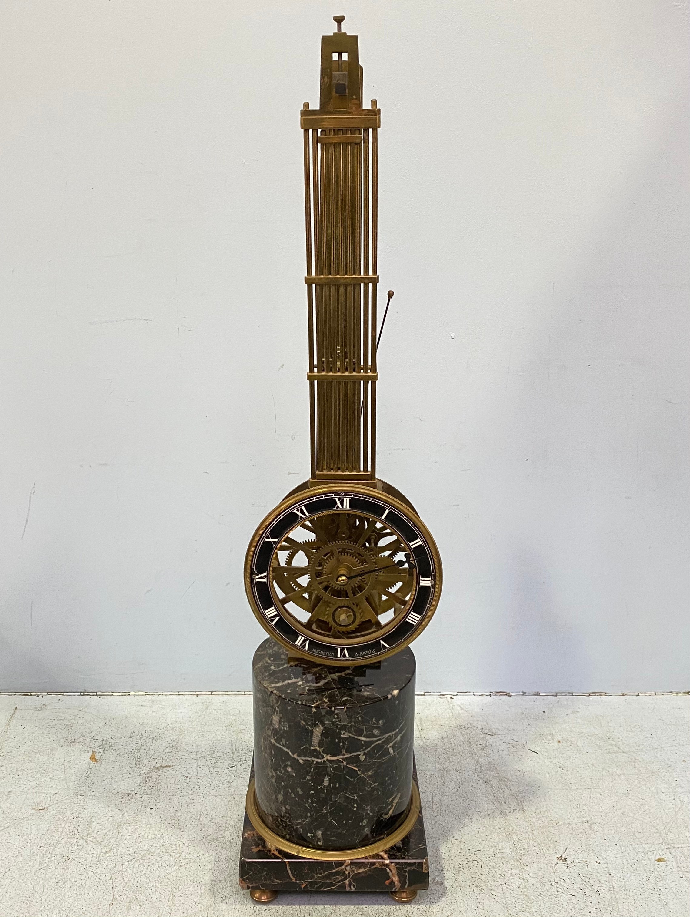 A French swinging pendulum clock, by Huguenin A Paris, the black chapter ring with Roman numerals