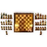 ‘The History of Golf’, resin chess set, the pieces modelled as historic golfing figures and