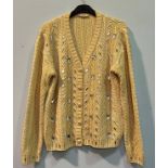 An early 90s Yves Saint Laurent cream woollen cardigan with gold embellishment, geometric knitted