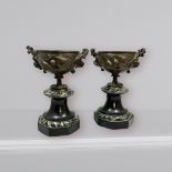 A pair of cast bronze urns, with cast naturalistic decoration of, crawling vines, leaves,