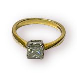 An 18ct yellow gold ring, set with a princess cut diamond, in 4 x 18ct white gold box claws,