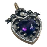 WITHDRAWN - A yellow metal heart shaped pendant, set with an amethyst pendant to the centre, in a