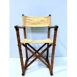 An ash and cream canvas folding campaign / director’s style chair, canvas seat and back support,