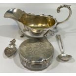 A George III Irish silver sifting spoon, (marks rubbed), together with a Dutch silver caddy spoon