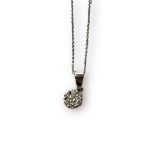 An 18ct white gold pendant, set with small round diamonds in a daisy design, weighs 1.5 grams,