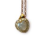 A heart-shaped pendant, set with a heart opaque stone to the centre, and16 x faceted white stones