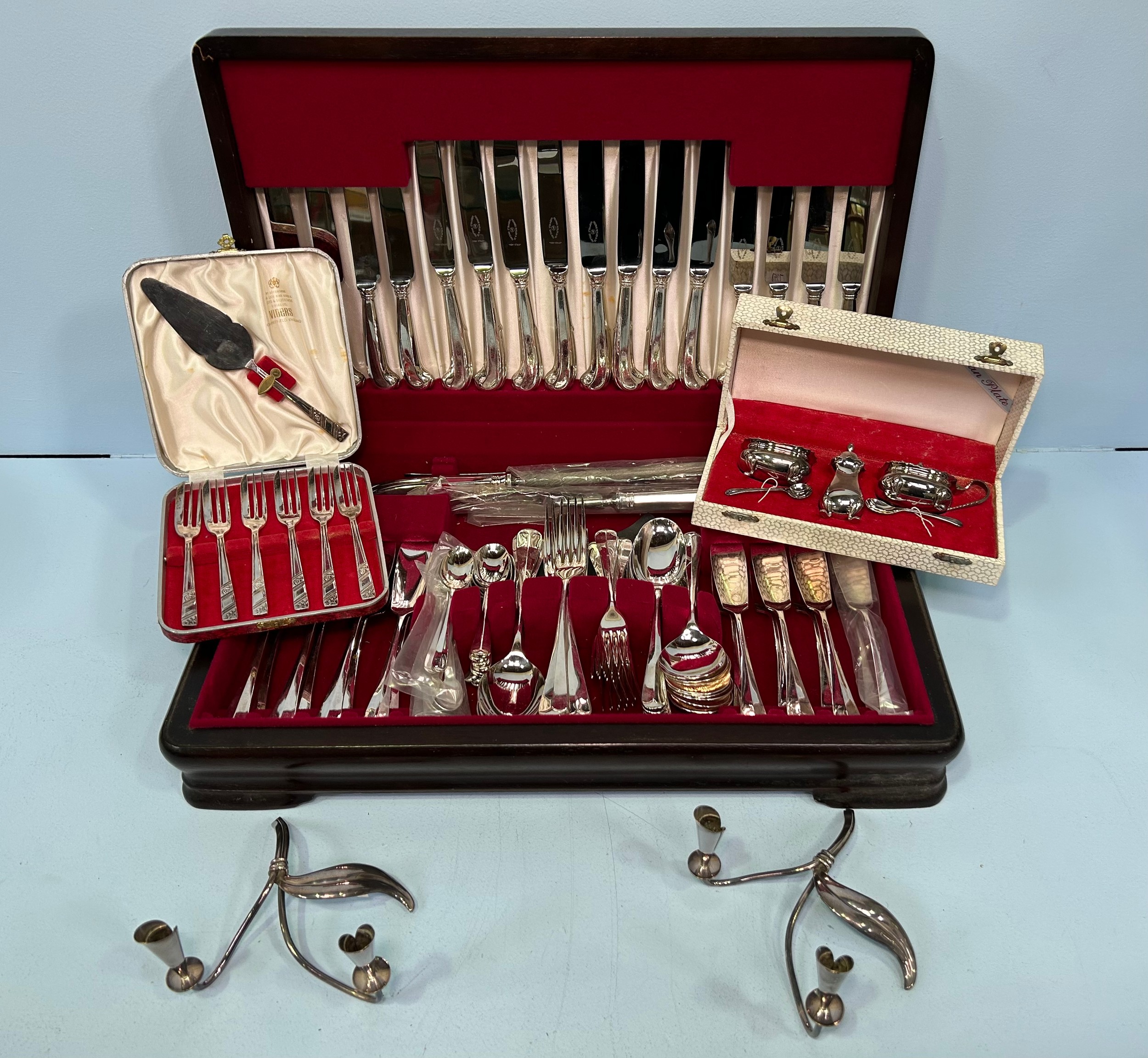 A George Butler & Co canteen of silver-plated cutlery for eight persons, including a carving set, in