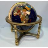 A large hardstone terrestrial globe, approximately 40cm high x 44cm wide