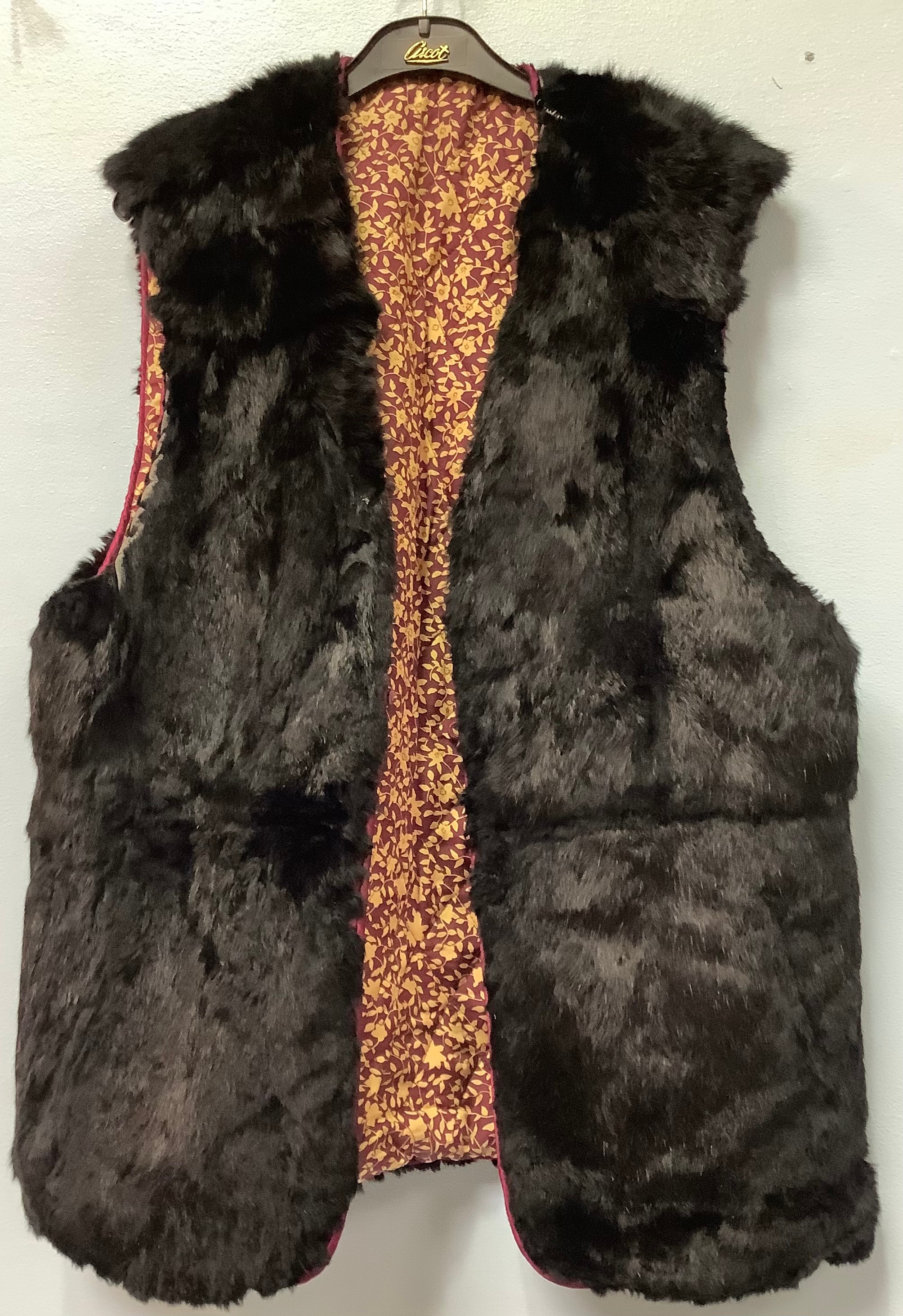 A three-quarter length light brown mink fur coat, probably from Hong Kong, a lady’s three-quarter