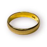 A 22ct yellow gold wedding ring, weighing 4.1 grams.
