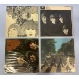 Four various early pressing 'The Beatles' vinyl LP albums in original sleeves, to include '