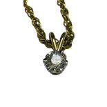 A solitaire diamond pendant, on a 9ct yellow gold chain, estimated weight of diamond 0.20cts,