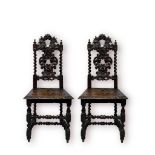 A pair of late 19th century Jacobean Revival oak hall side chairs, scrolled carved and pierced