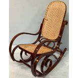 A 'thonet' style bentwood rocking chair with rattan back and seat panel.