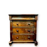 A Victorian flame-mahogany veneered chest, with pulvinated top drawer above three long drawers