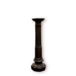 A bronzed composite Doric column pedestal / jardiniere stand, with circular top, half-fluted