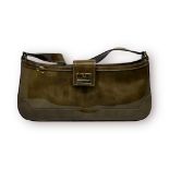 A ladys Salvatore Ferragamo small dark sage coloured patent leather handbag, with signature gold-