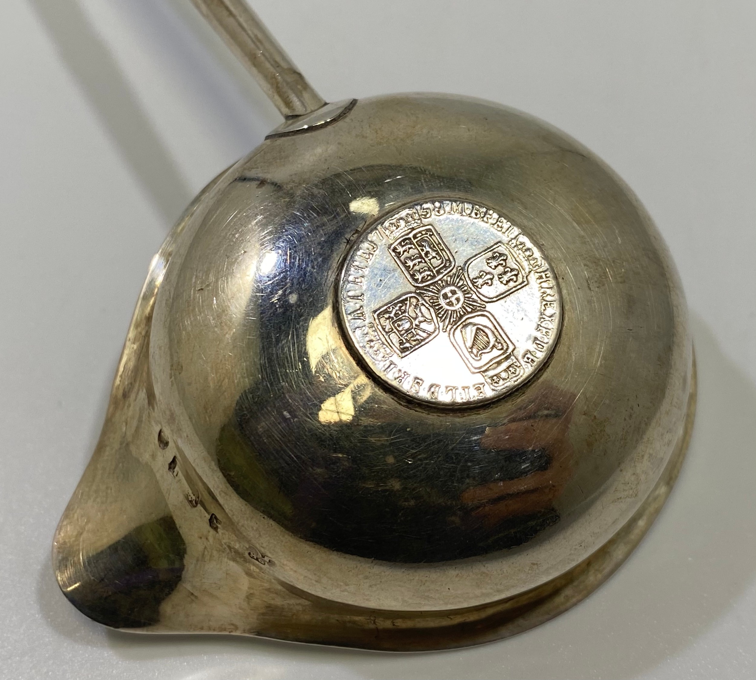 A George II silver toddy spoon, the bowl inset with a silver shilling and turned horn handle, - Image 2 of 4