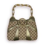 Gucci GG monogram pattern in beige canvas and patent snakeskin leather design, top handle bag, 2x