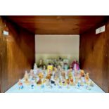 A collection of fifty-two assorted Wade and Wade Ireland ceramic figures, to include, 18/20 large ‘