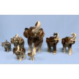 A collection of seven Royal Dux pottery figures of elephants, each with factory marks to bases,