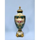 A large Royal Bonn printed porcelain urn and cover, central panel of floral design, painted blue and