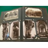 A large album containing approximately 450 standard-size postcards, including English topographical,